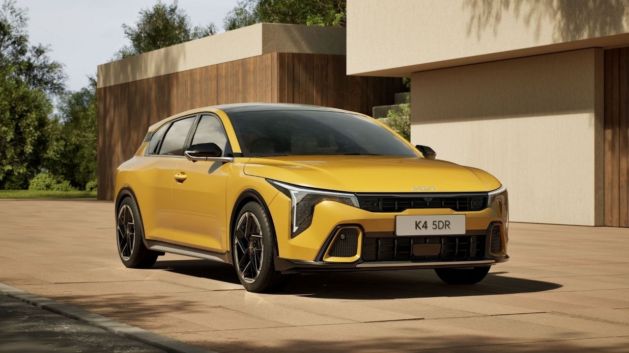 Yellow Gold Kia K4 Parked on Driveway 